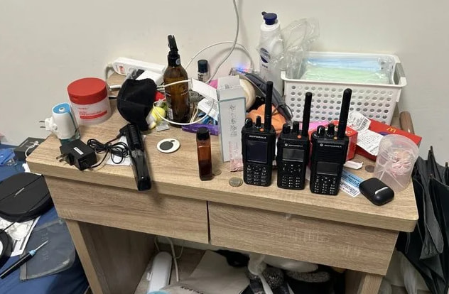 Handheld radios were seized at Lin's residence